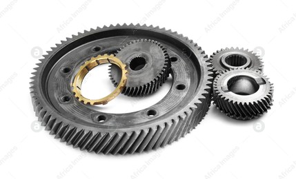 Different stainless steel gears on white background Photo of Different stainless steel gears on white background