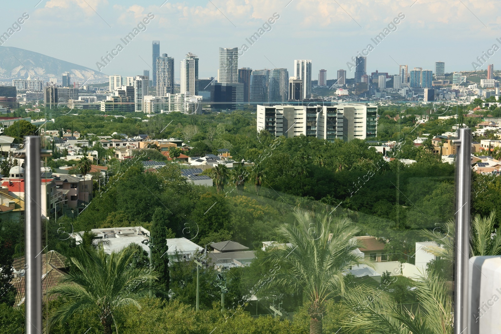 Picturesque view of city and green trees Photo of Picturesque view of city and green trees