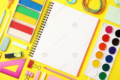 Flat lay composition with different school stationery on yellow background, space for text. Back to school Photo of Flat lay composition with different school stationery on yellow background, space for text. Back to school