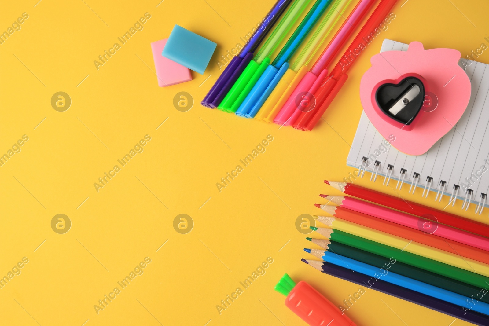 Flat lay composition with different school stationery on yellow background, space for text. Back to school Photo of Flat lay composition with different school stationery on yellow background, space for text. Back to school