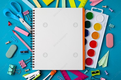 Different school stationery items and notebook on light blue background, flat lay with space for text. Back to school Photo of Different school stationery items and notebook on light blue background, flat lay with space for text. Back to school