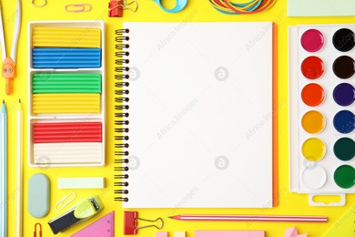 Flat lay composition with different school stationery on yellow background, space for text. Back to school Photo of Flat lay composition with different school stationery on yellow background, space for text. Back to school
