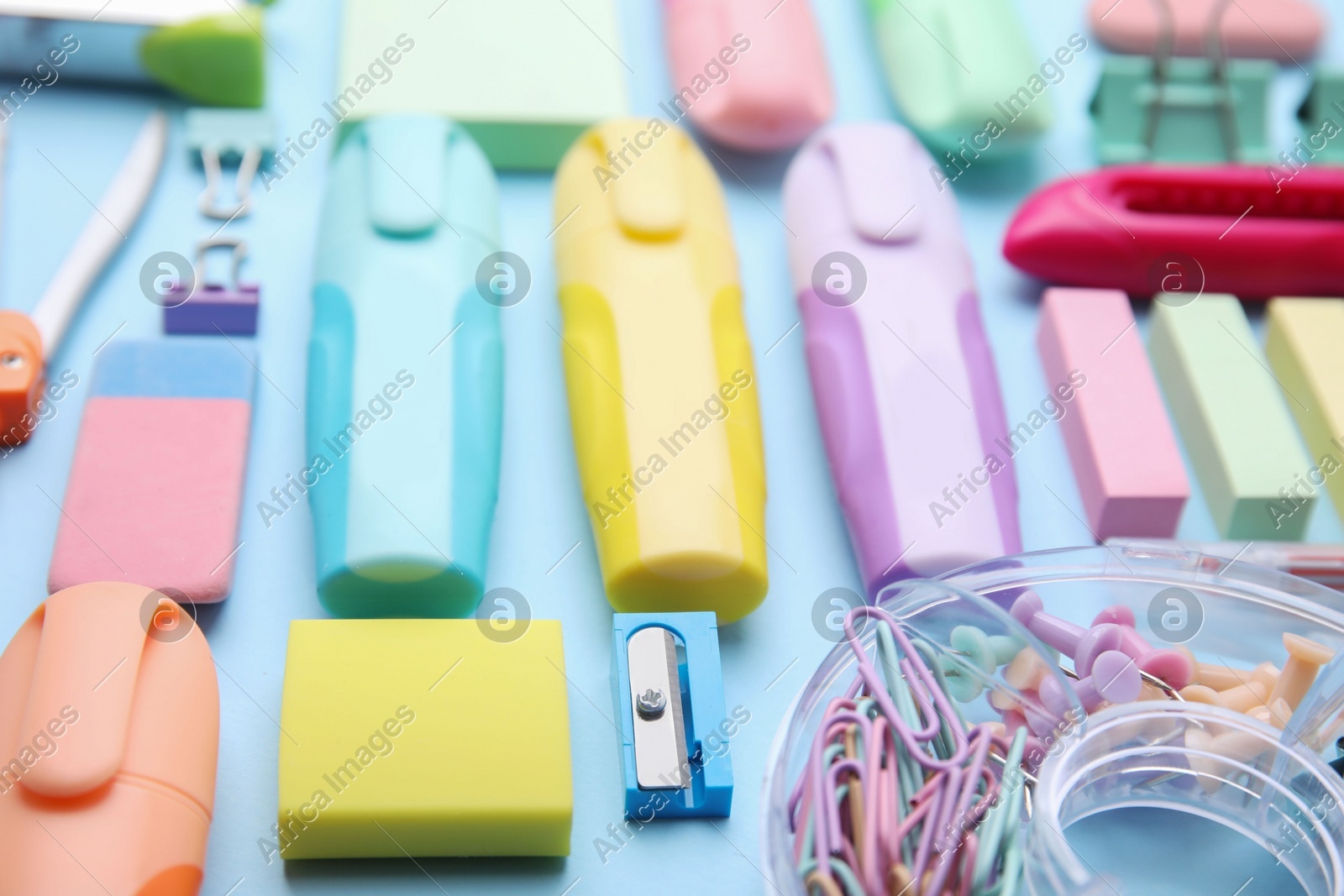 Many different school stationery on light blue background, closeup. Back to school Photo of Many different school stationery on light blue background, closeup. Back to school