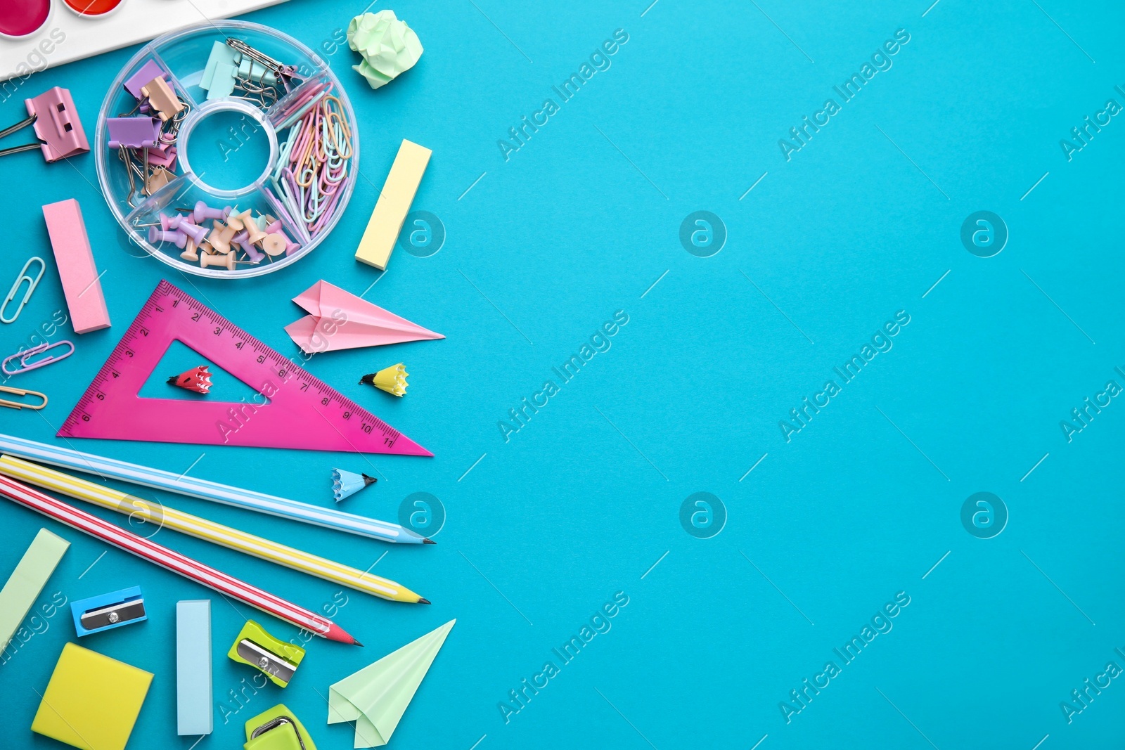 Different school stationery items on light blue background, flat lay with space for text. Back to school Photo of Different school stationery items on light blue background, flat lay with space for text. Back to school