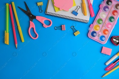 Flat lay composition with notebook and other school stationery on light blue background, space for text. Back to school Photo of Flat lay composition with notebook and other school stationery on light blue background, space for text. Back to school