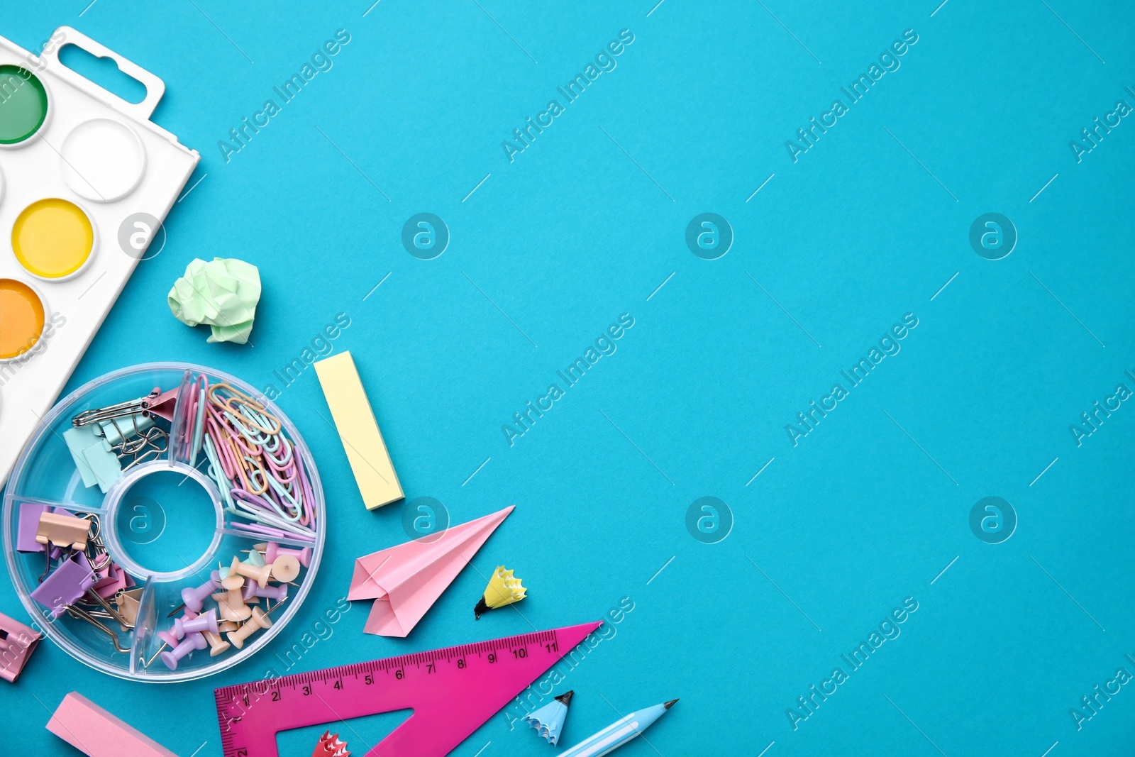 Different school stationery items on light blue background, flat lay with space for text. Back to school Photo of Different school stationery items on light blue background, flat lay with space for text. Back to school