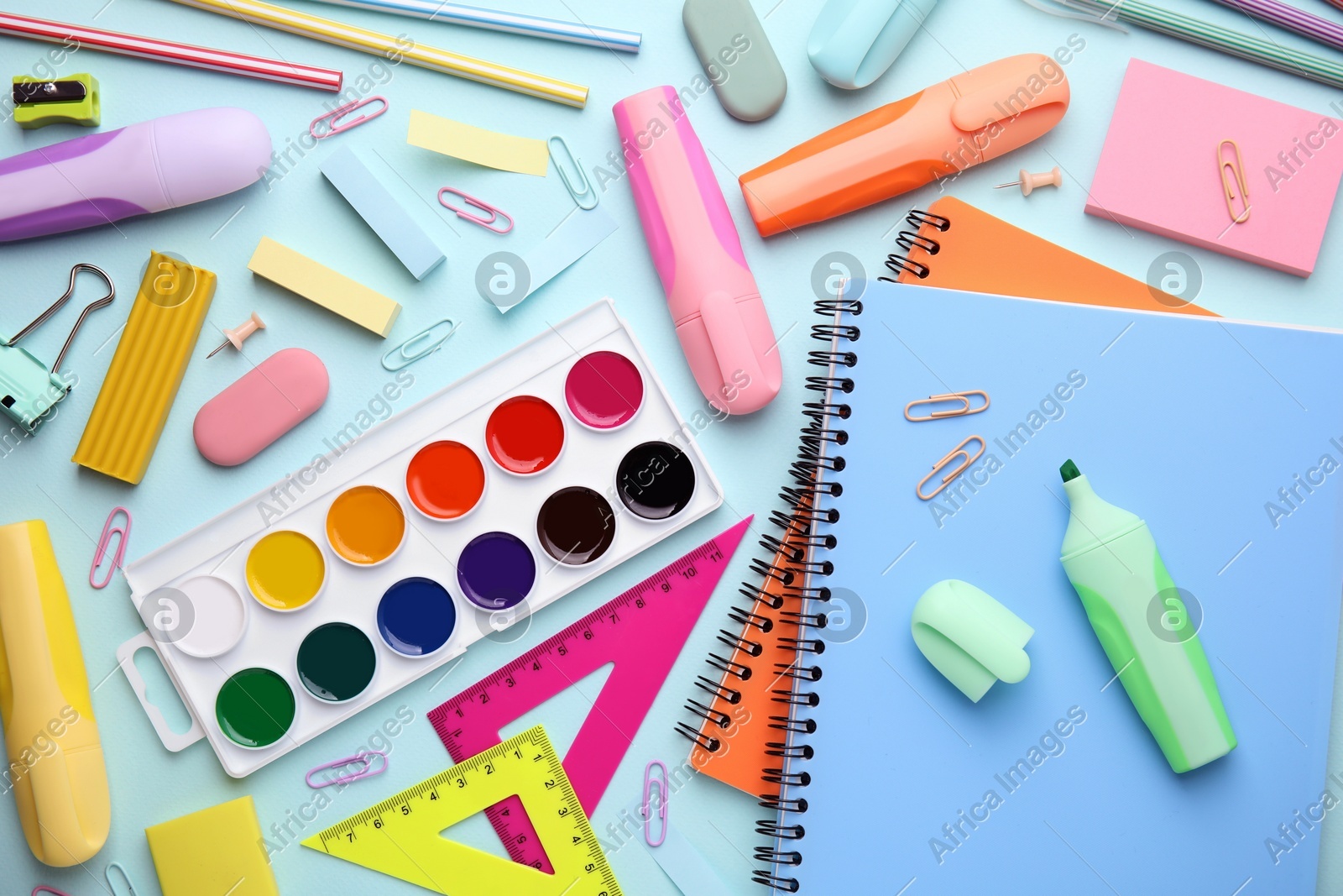 Different school stationery on light background, flat lay. Back to school Photo of Different school stationery on light background, flat lay. Back to school