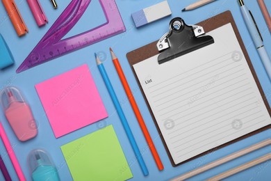 Flat lay composition with different school stationery on light blue background, space for text. Back to school Photo of Flat lay composition with different school stationery on light blue background, space for text. Back to school