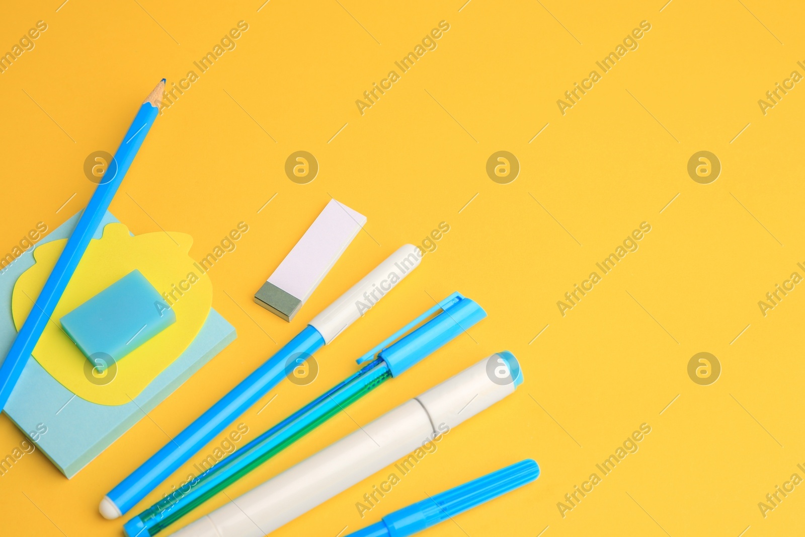 Different school stationery on yellow background, space for text. Back to school Photo of Different school stationery on yellow background, space for text. Back to school