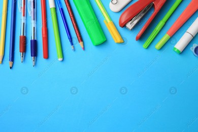 Flat lay composition with different school stationery on light blue background, space for text. Back to school Photo of Flat lay composition with different school stationery on light blue background, space for text. Back to school