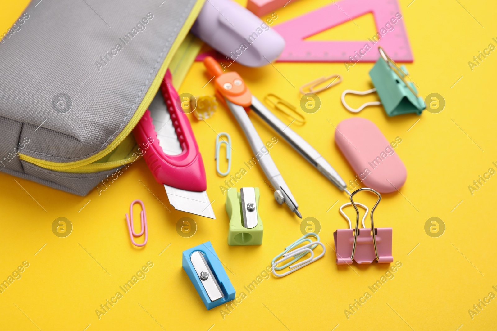 Many different school stationery on yellow background. Back to school Photo of Many different school stationery on yellow background. Back to school
