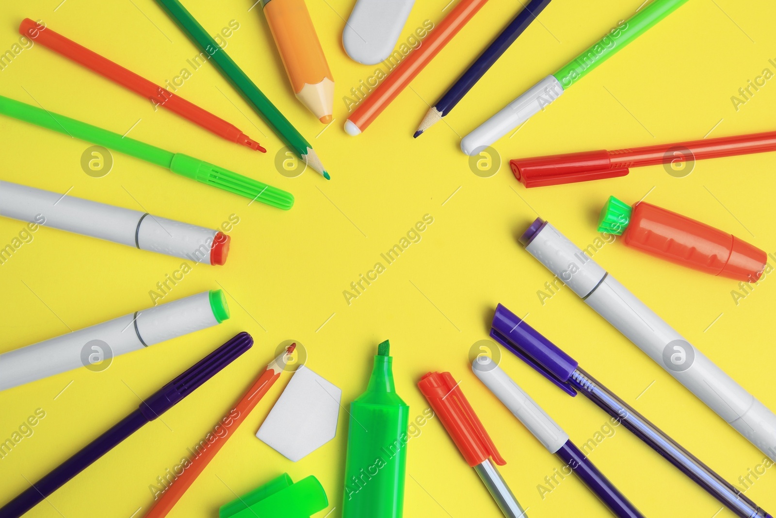 Frame of different school stationery on yellow background, flat lay with space for text. Back to school Photo of Frame of different school stationery on yellow background, flat lay with space for text. Back to school