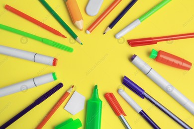Frame of different school stationery on yellow background, flat lay with space for text. Back to school Photo of Frame of different school stationery on yellow background, flat lay with space for text. Back to school