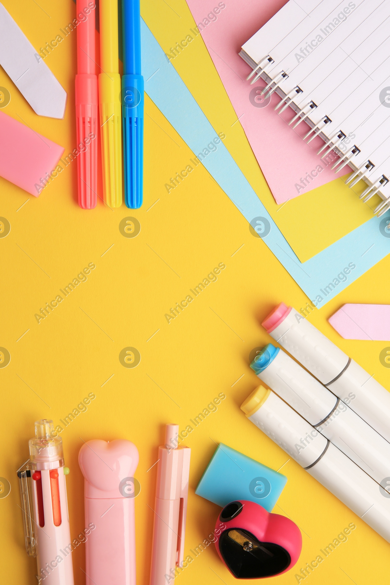 Different school stationery on yellow background, flat lay with space for text. Back to school Photo of Different school stationery on yellow background, flat lay with space for text. Back to school