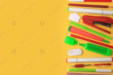 Flat lay composition with different school stationery on orange background, space for text. Back to school Photo of Flat lay composition with different school stationery on orange background, space for text. Back to school