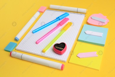 Different school stationery on yellow background. Back to school Photo of Different school stationery on yellow background. Back to school