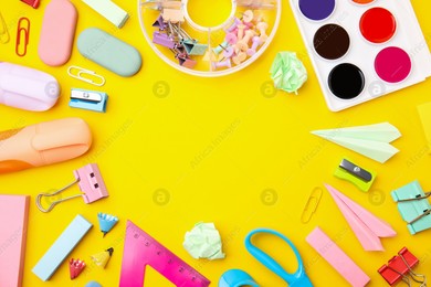 Flat lay composition with different school stationery on yellow background, space for text. Back to school Photo of Flat lay composition with different school stationery on yellow background, space for text. Back to school