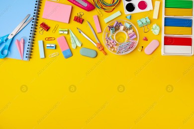 Flat lay composition with different school stationery on yellow background, space for text. Back to school Photo of Flat lay composition with different school stationery on yellow background, space for text. Back to school
