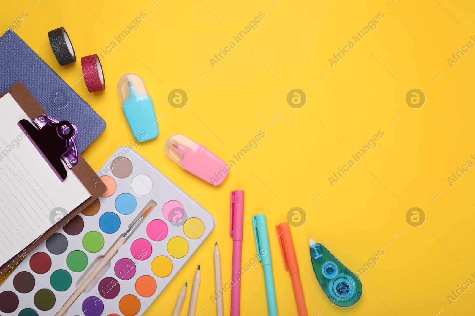 Flat lay composition with different school stationery on yellow background, space for text. Back to school Photo of Flat lay composition with different school stationery on yellow background, space for text. Back to school
