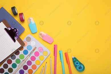 Flat lay composition with different school stationery on yellow background, space for text. Back to school Photo of Flat lay composition with different school stationery on yellow background, space for text. Back to school