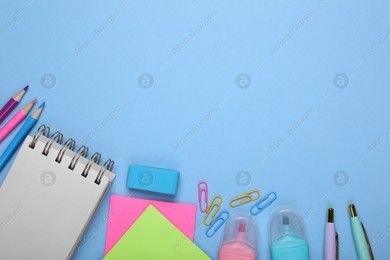 Flat lay composition with different school stationery on light blue background, space for text. Back to school Photo of Flat lay composition with different school stationery on light blue background, space for text. Back to school