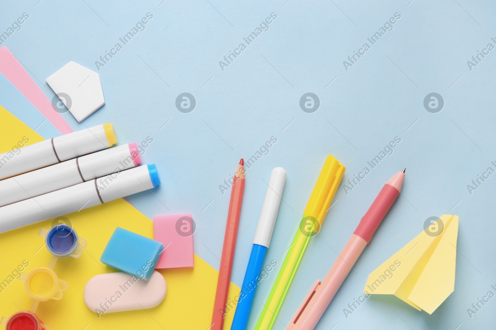 Flat lay composition with different school stationery on light blue background. Back to school Photo of Flat lay composition with different school stationery on light blue background. Back to school