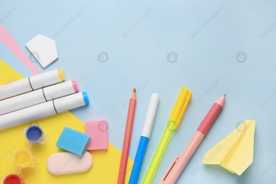 Flat lay composition with different school stationery on light blue background. Back to school Photo of Flat lay composition with different school stationery on light blue background. Back to school