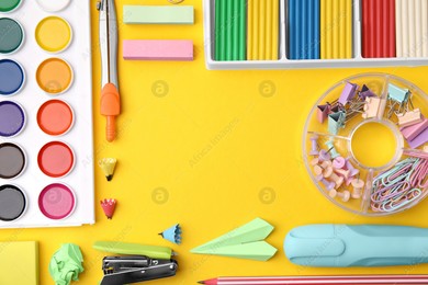 Flat lay composition with different school stationery on yellow background, space for text. Back to school Photo of Flat lay composition with different school stationery on yellow background, space for text. Back to school
