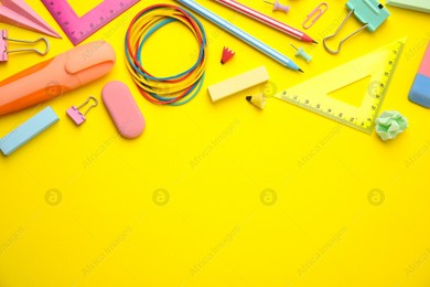 Flat lay composition with different school stationery on yellow background, space for text. Back to school Photo of Flat lay composition with different school stationery on yellow background, space for text. Back to school