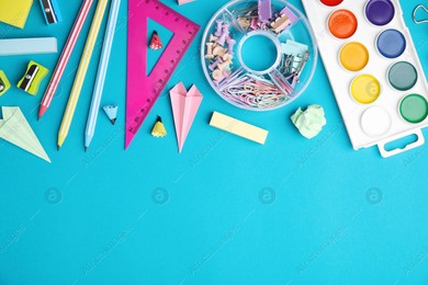 Different school stationery items on light blue background, flat lay with space for text. Back to school Photo of Different school stationery items on light blue background, flat lay with space for text. Back to school