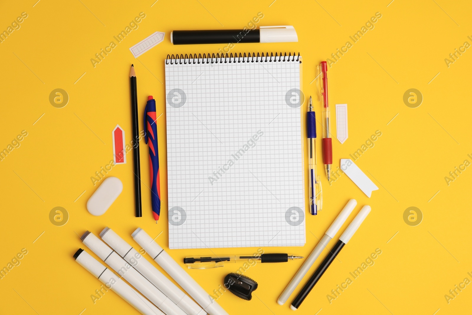 Different school stationery on yellow background, flat lay with space for text. Back to school Photo of Different school stationery on yellow background, flat lay with space for text. Back to school