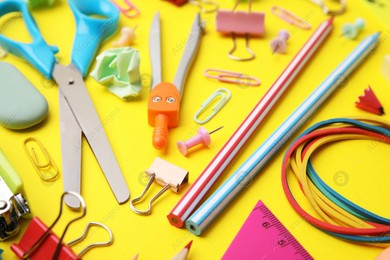 Different school stationery on yellow background, closeup. Back to school Photo of Different school stationery on yellow background, closeup. Back to school