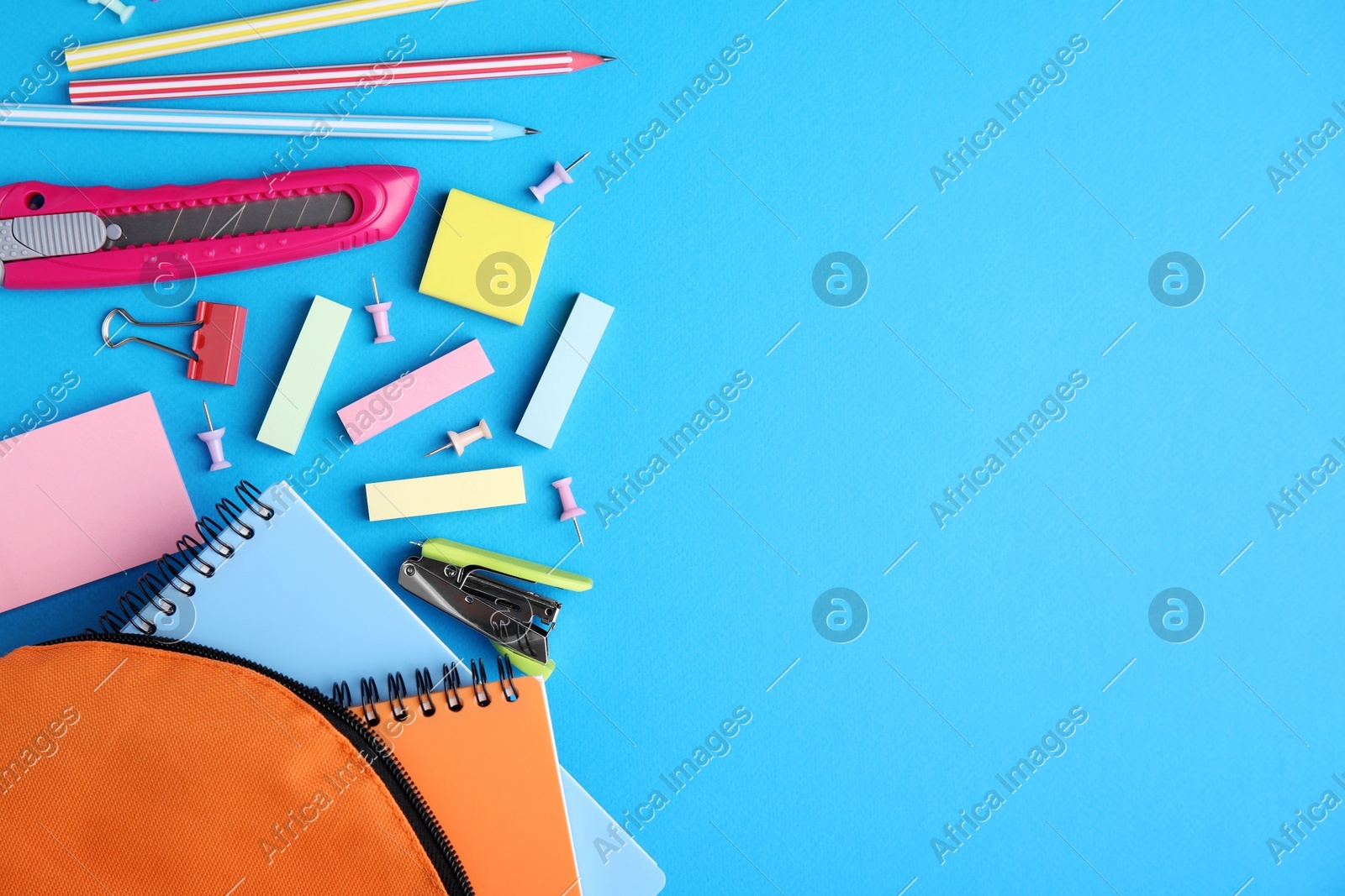 Different school stationery on light blue background, flat lay with space for text. Back to school Photo of Different school stationery on light blue background, flat lay with space for text. Back to school