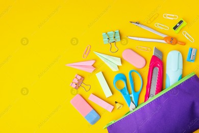 Flat lay composition with different school stationery on yellow background, space for text. Back to school Photo of Flat lay composition with different school stationery on yellow background, space for text. Back to school