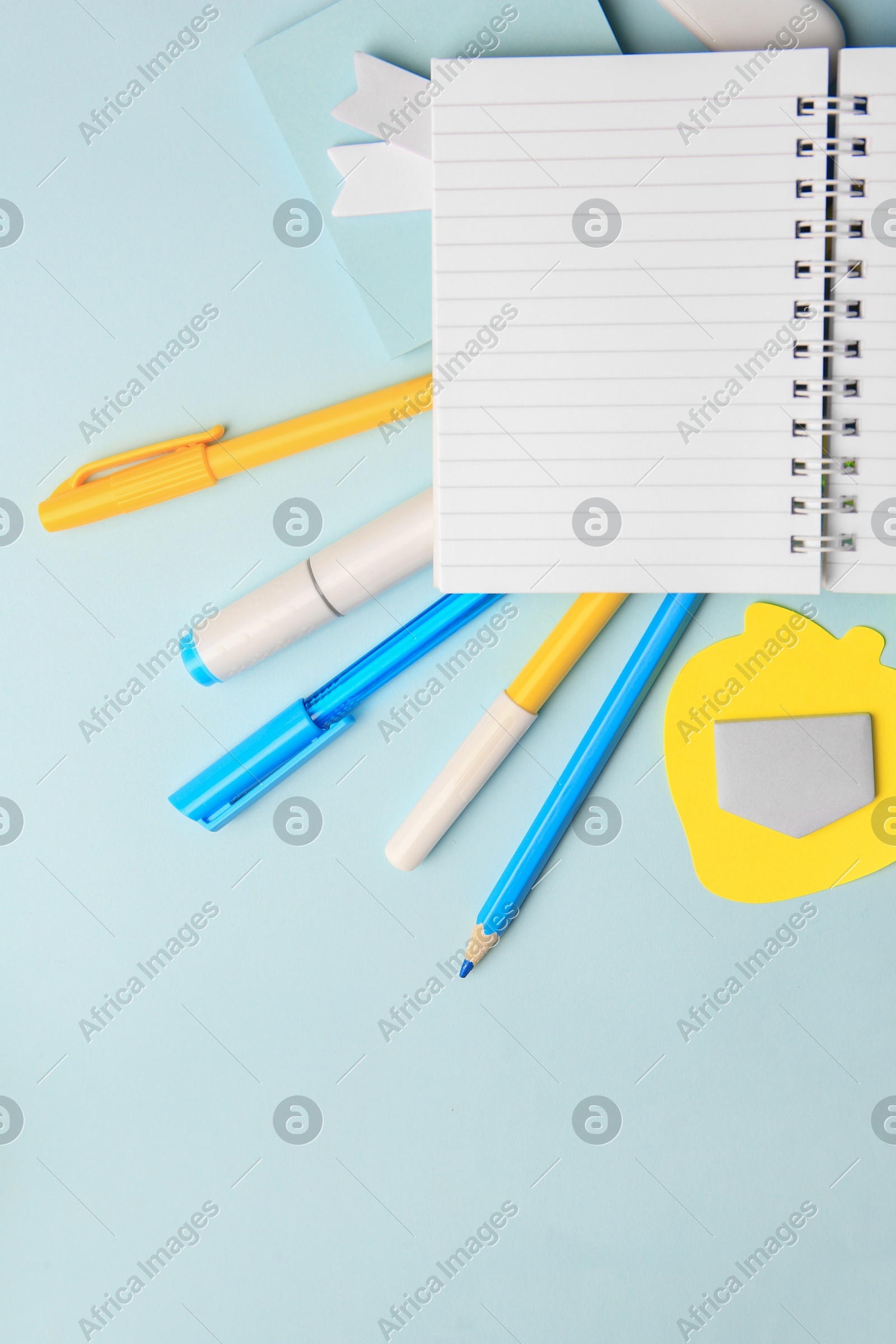 Different school stationery on light blue background, flat lay with space for text. Back to school Photo of Different school stationery on light blue background, flat lay with space for text. Back to school
