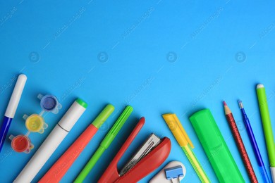 Flat lay composition with different school stationery on light blue background, space for text. Back to school Photo of Flat lay composition with different school stationery on light blue background, space for text. Back to school