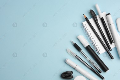 Flat lay composition with different school stationery on light blue background, space for text. Back to school Photo of Flat lay composition with different school stationery on light blue background, space for text. Back to school