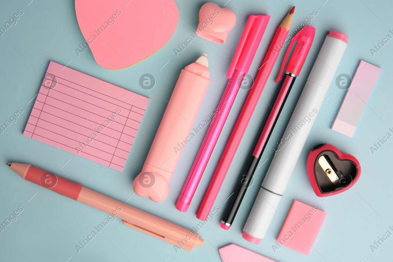 Flat lay composition with sticky note and other school stationery on light blue background. Back to school Photo of Flat lay composition with sticky note and other school stationery on light blue background. Back to school