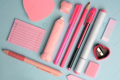 Flat lay composition with sticky note and other school stationery on light blue background. Back to school Photo of Flat lay composition with sticky note and other school stationery on light blue background. Back to school