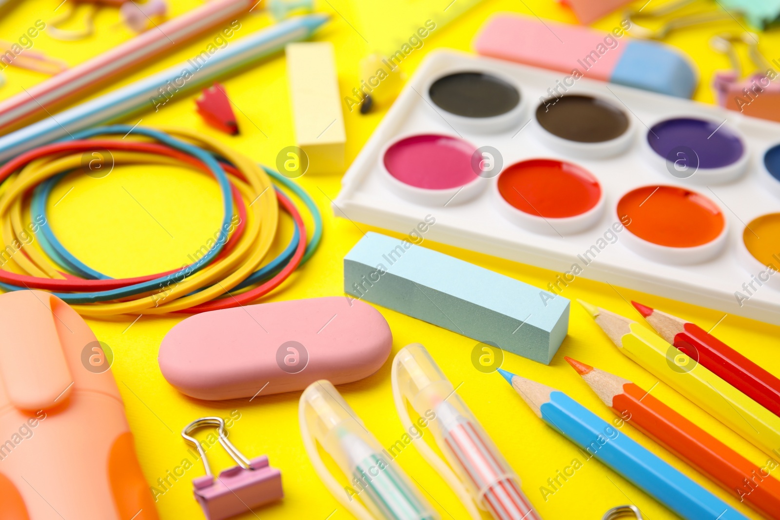 Different school stationery on yellow background, closeup. Back to school Photo of Different school stationery on yellow background, closeup. Back to school