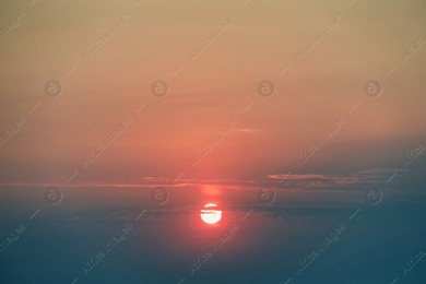 Picturesque view of sky with sun at sunset Photo of Picturesque view of sky with sun at sunset