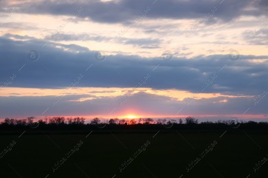Picturesque view of beautiful countryside at sunset Photo of Picturesque view of beautiful countryside at sunset