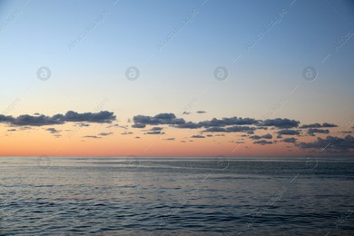 Picturesque view of sea under beautiful sky at sunset Photo of Picturesque view of sea under beautiful sky at sunset
