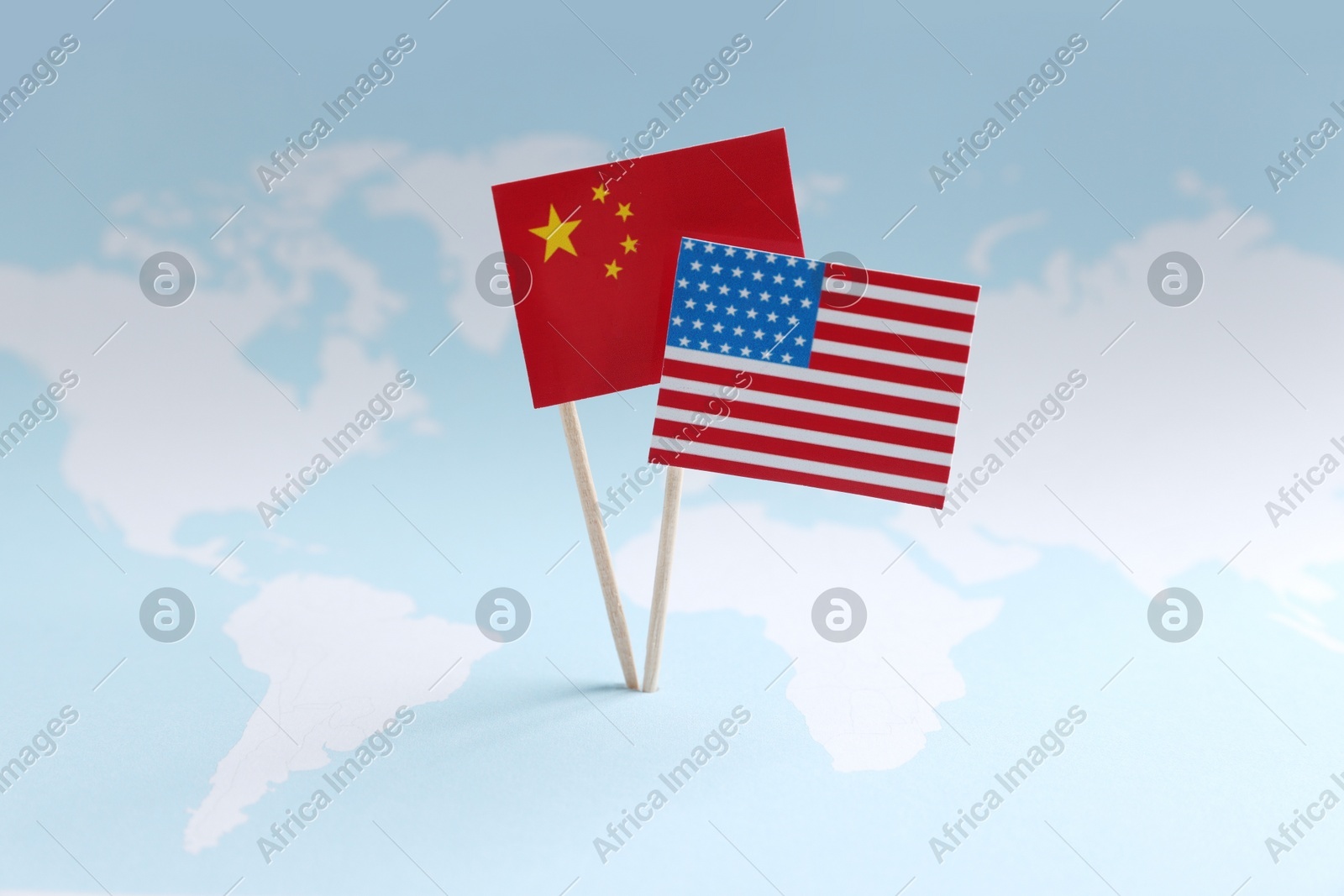 American and Chinese flags on world map. Trade war concept Photo of American and Chinese flags on world map. Trade war concept