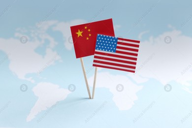American and Chinese flags on world map. Trade war concept Photo of American and Chinese flags on world map. Trade war concept