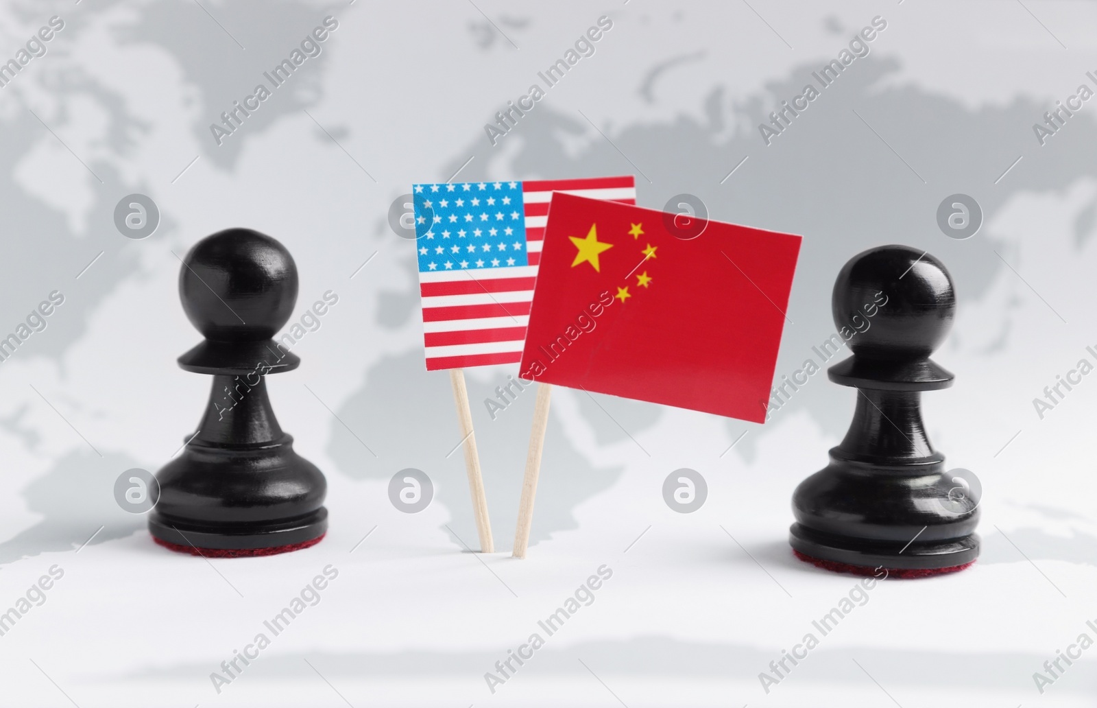 Chess pieces, American and Chinese flags on world map. Trade war concept Photo of Chess pieces, American and Chinese flags on world map. Trade war concept