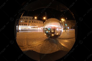 Crystal ball on asphalt road at night, wide-angle lens Photo of Crystal ball on asphalt road at night, wide-angle lens