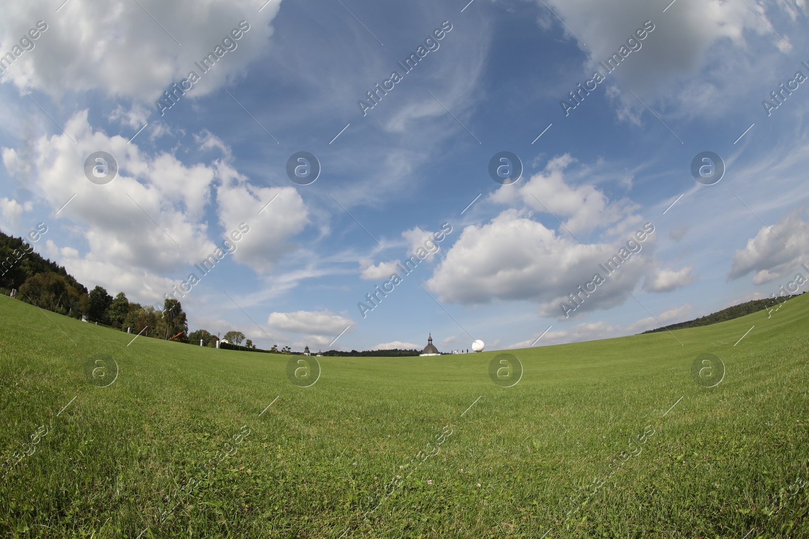Beautiful lawn with green grass growing under blue sky. Fisheye lens Photo of Beautiful lawn with green grass growing under blue sky. Fisheye lens