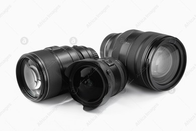 Camera lens on white background. Photographer's equipment Photo of Camera lens on white background. Photographer's equipment