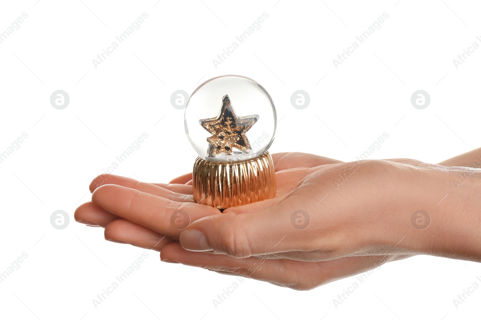 Woman holding beautiful snow globe on white background, closeup Photo of Woman holding beautiful snow globe on white background, closeup